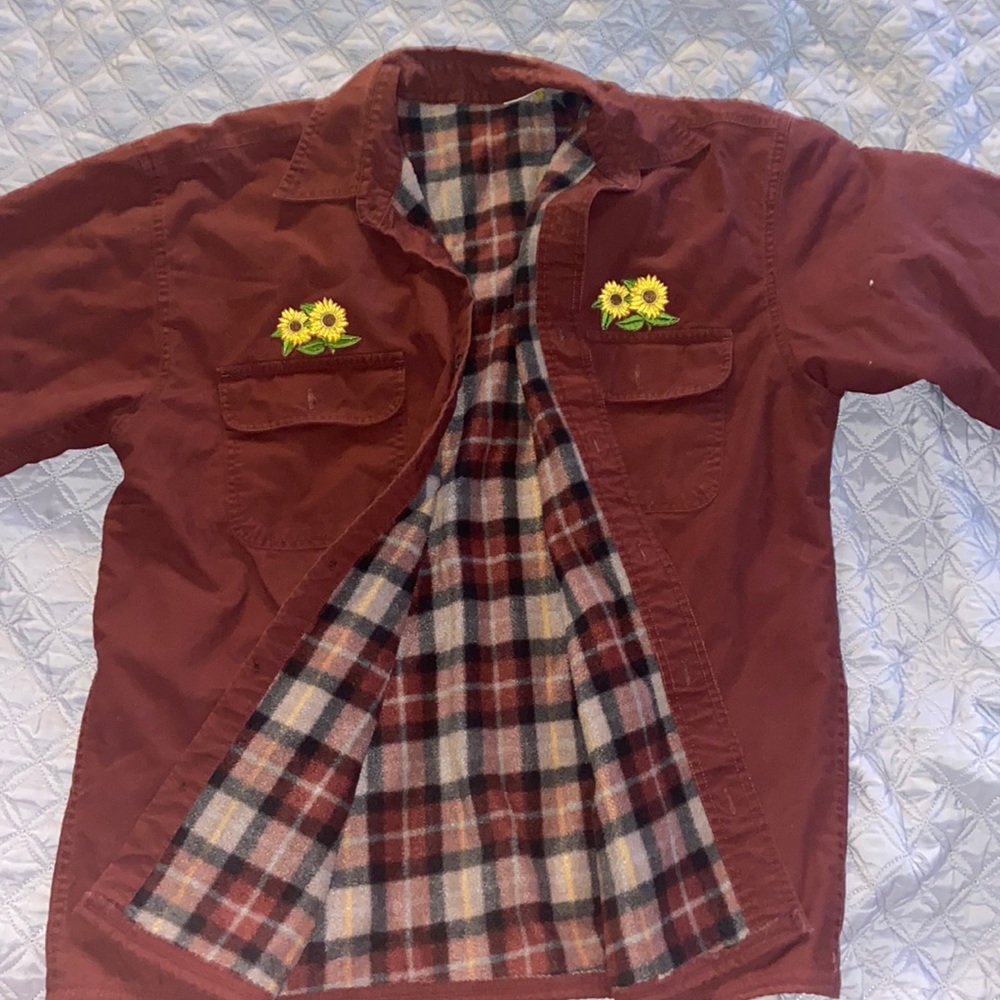 Dark reddish brown jacket, fluffy inside.